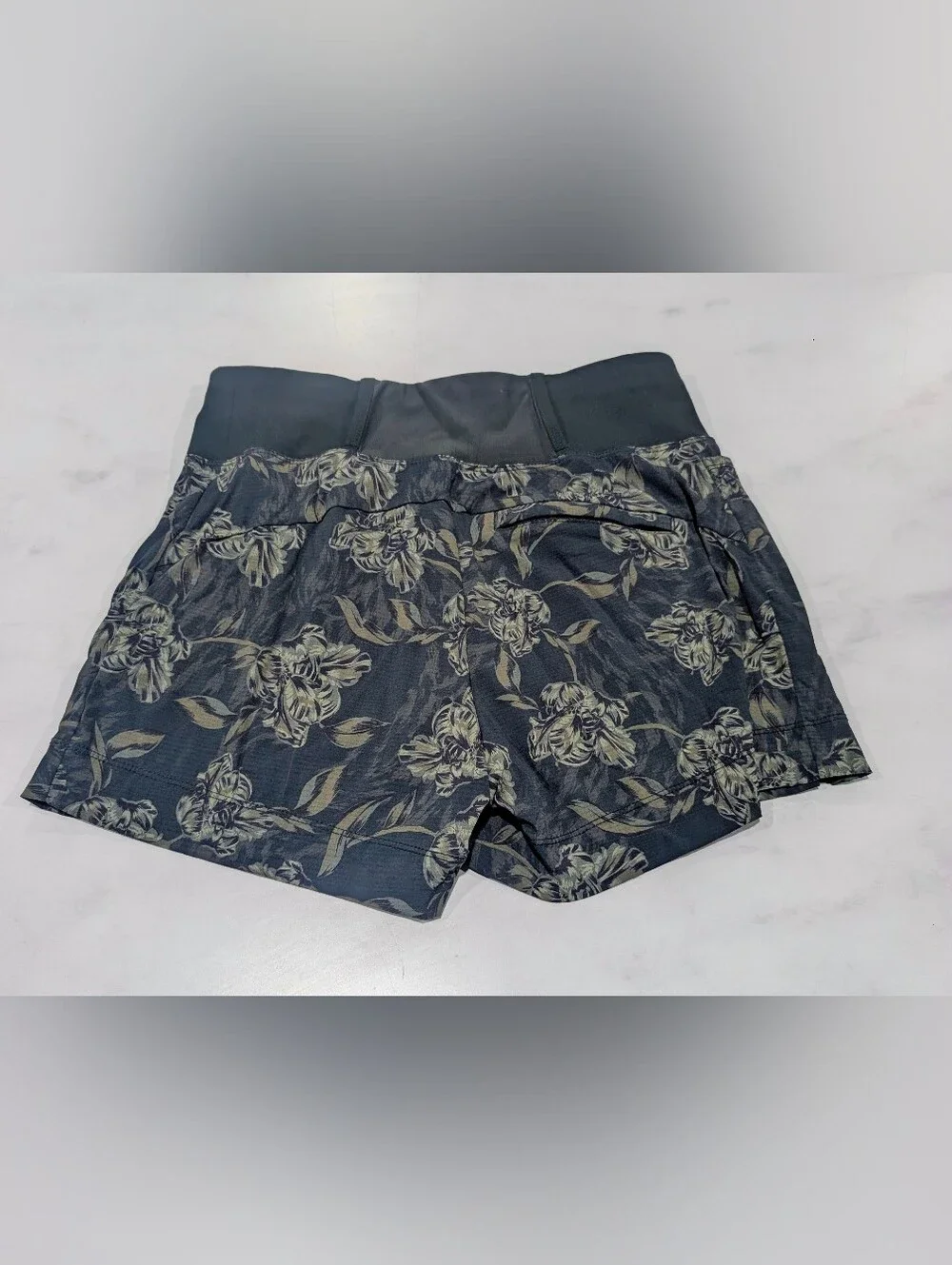 Athleta Dark Green Shorts with Beige Floral Print